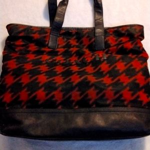 A coach red and black shoulder bag